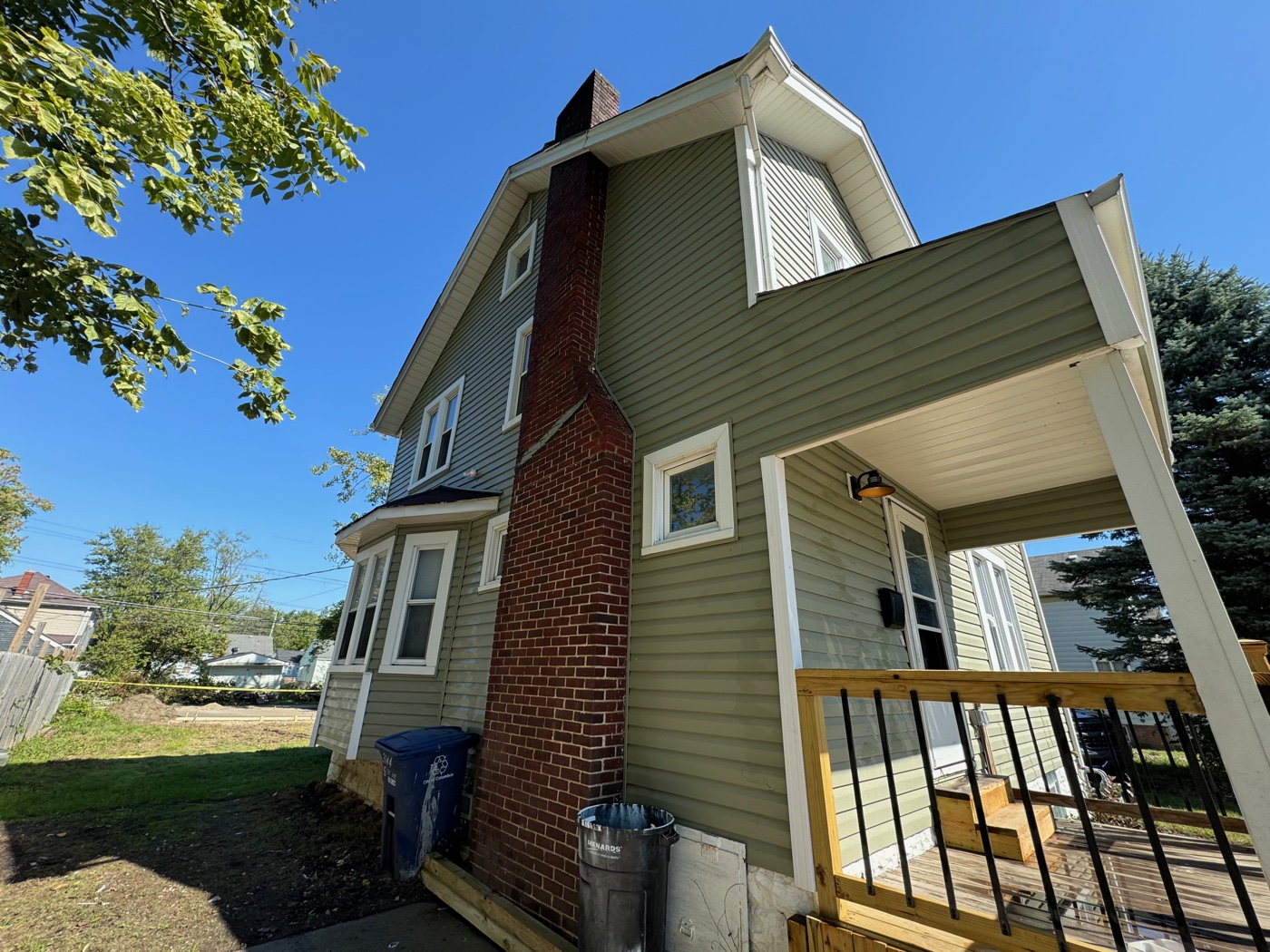 Soft-washed older brick home under mature trees in Gahanna, OH