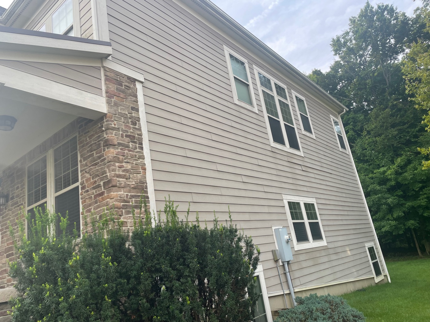 Soft-washed custom home exterior in New Albany, OH by Pinnacle Wash