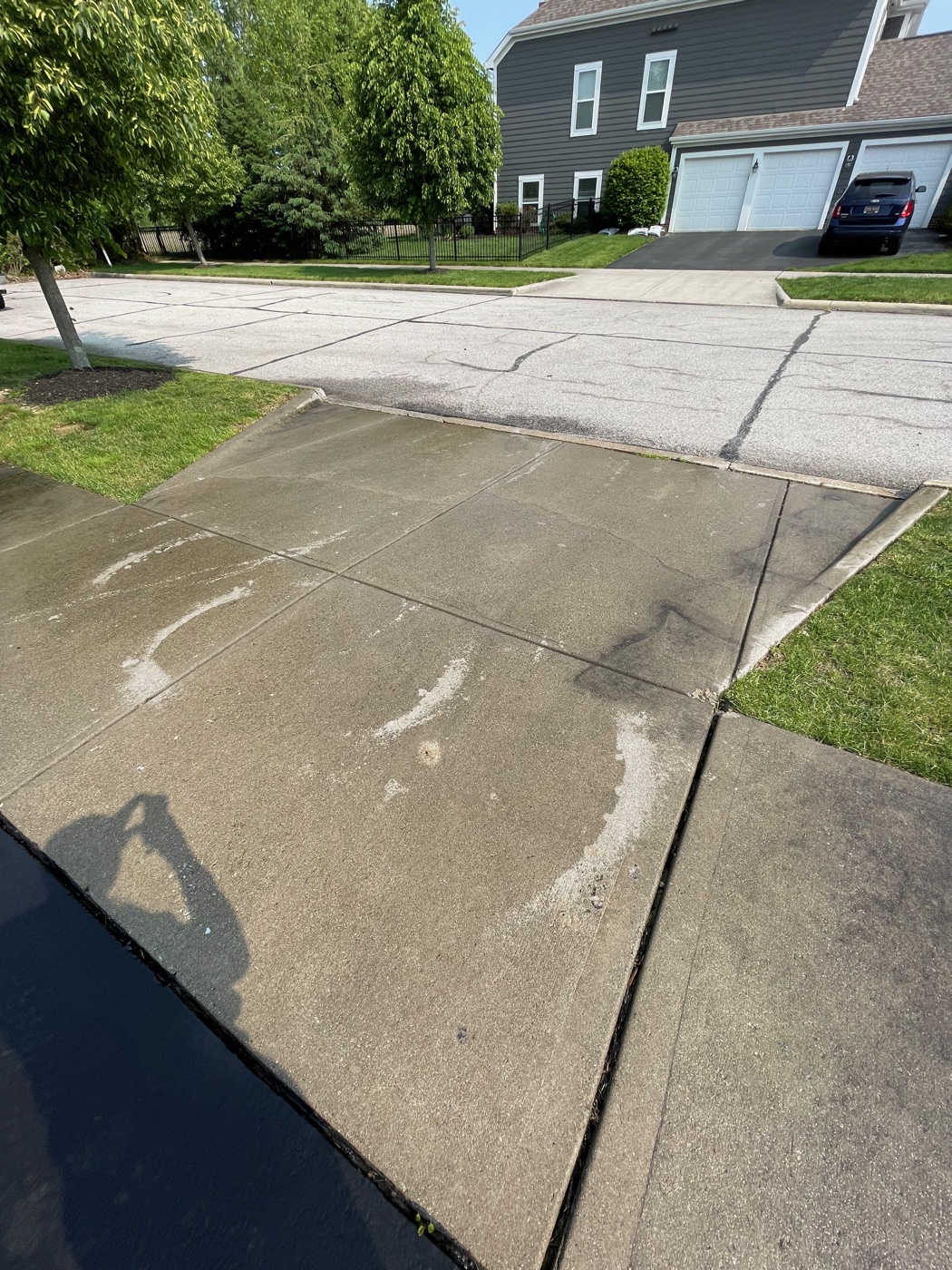 Clean wide concrete driveway after Pinnacle Wash surface-cleaner treatment in Pickerington, OH